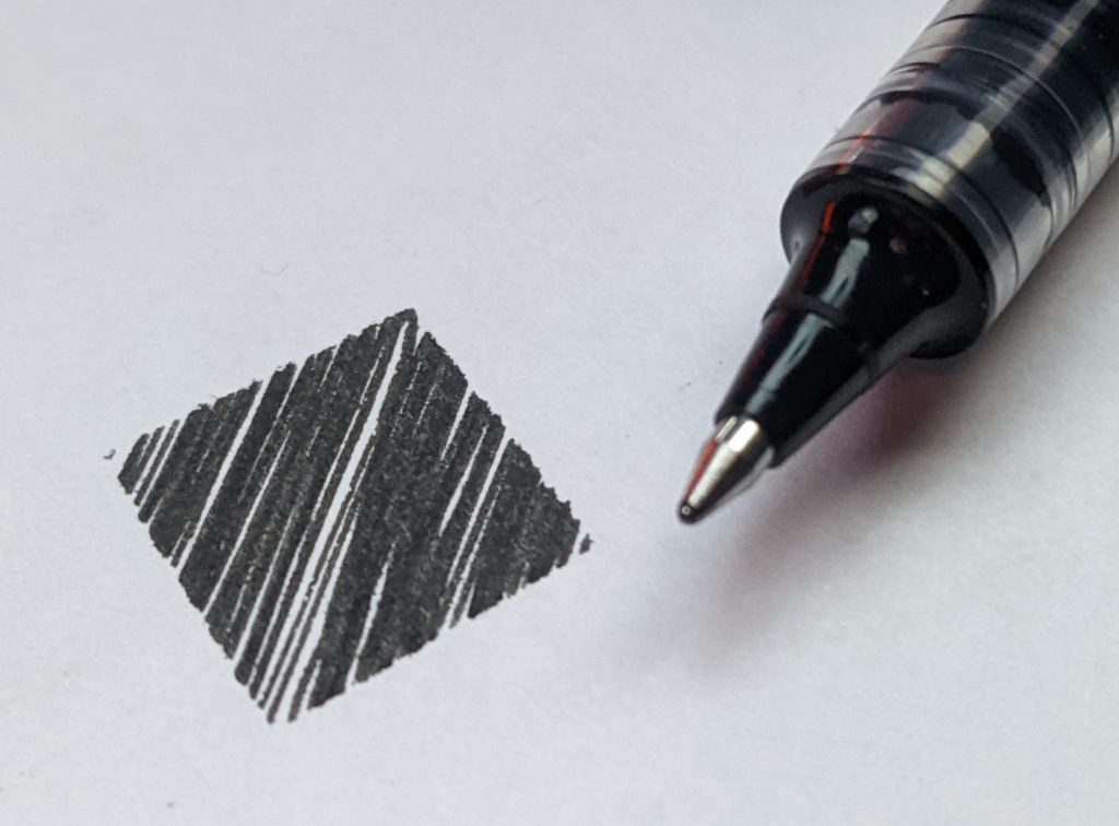 A sketch of a black square next to a ballpoint pen.